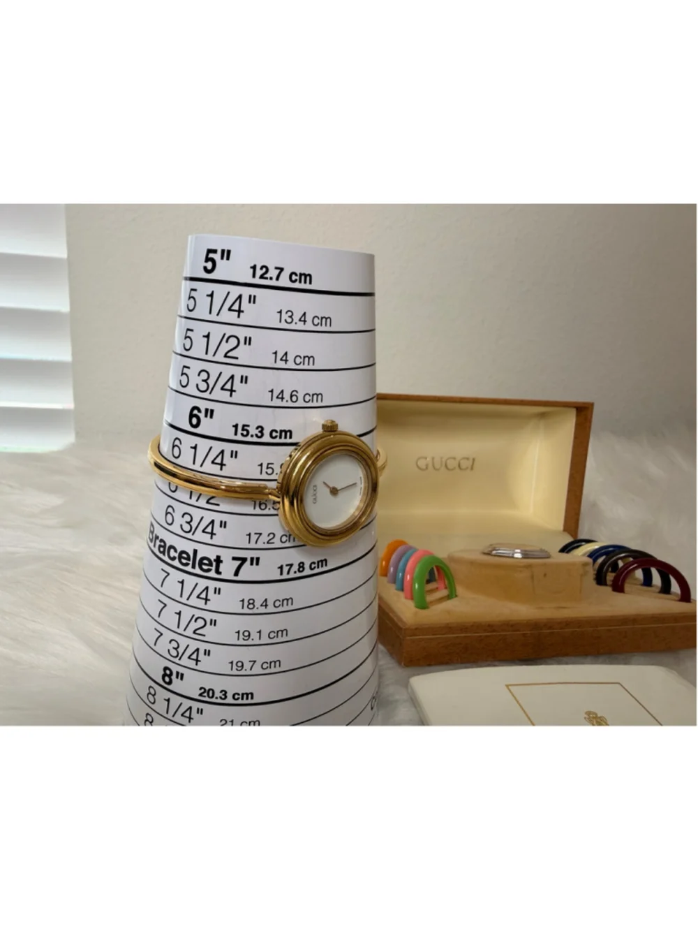 Gucci 11/12.2 Interchangeable Bezel Bangle Watch, w/ 12 bezels, box & paperwork